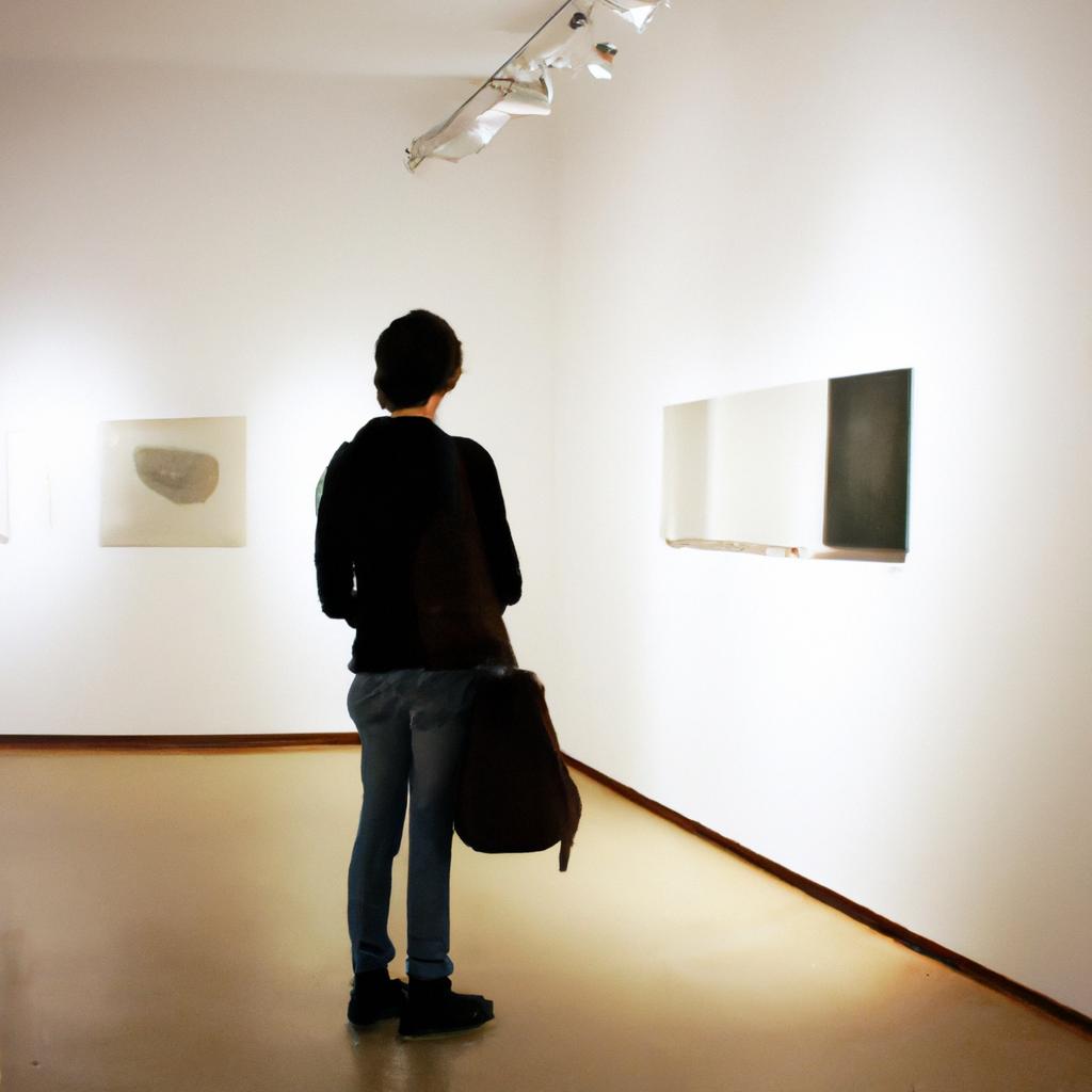 Person exploring art gallery exhibit